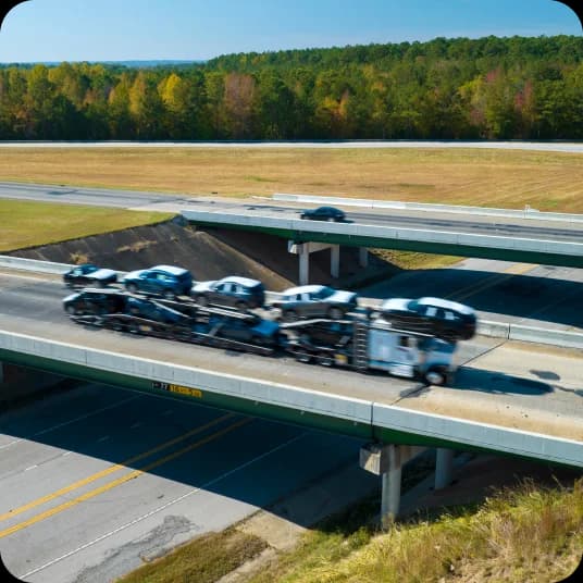 Truck carrying cars to next state