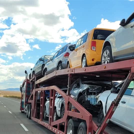 multiple cars on double-decker hauler