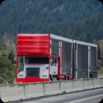 red enclosed car hauler