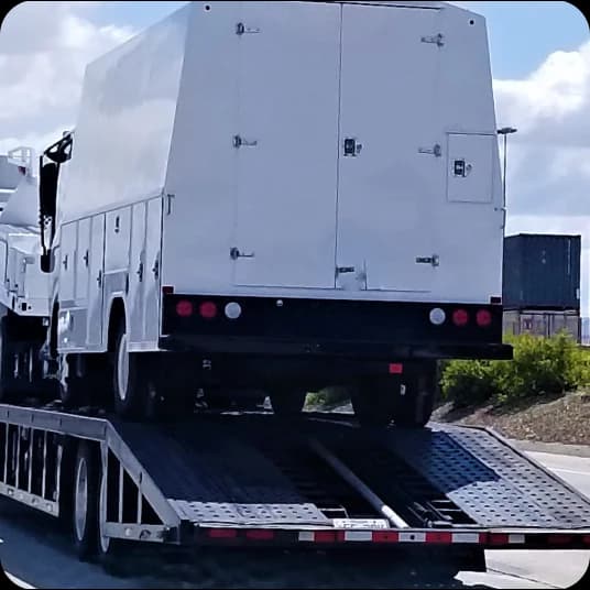 Truck about to carry heavy vehicle