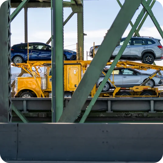 Car hauler on bridge while transporting