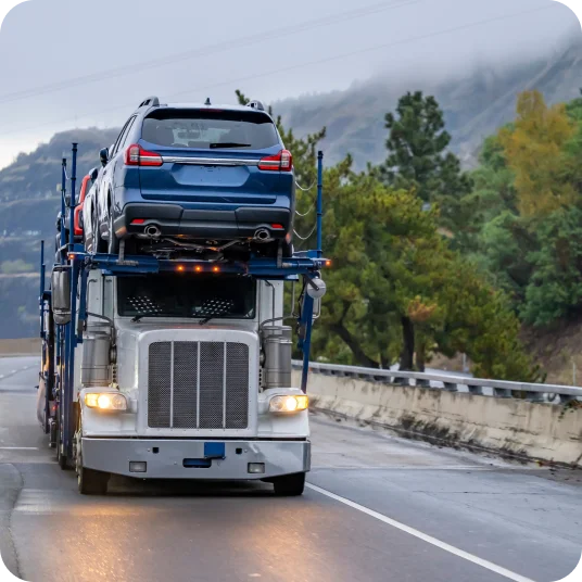 A car carrier full of cars on road