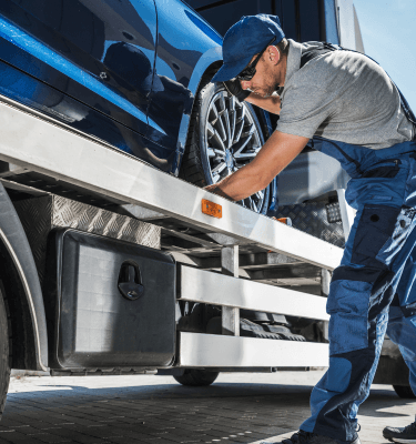 truck driver inspecting his vehicle