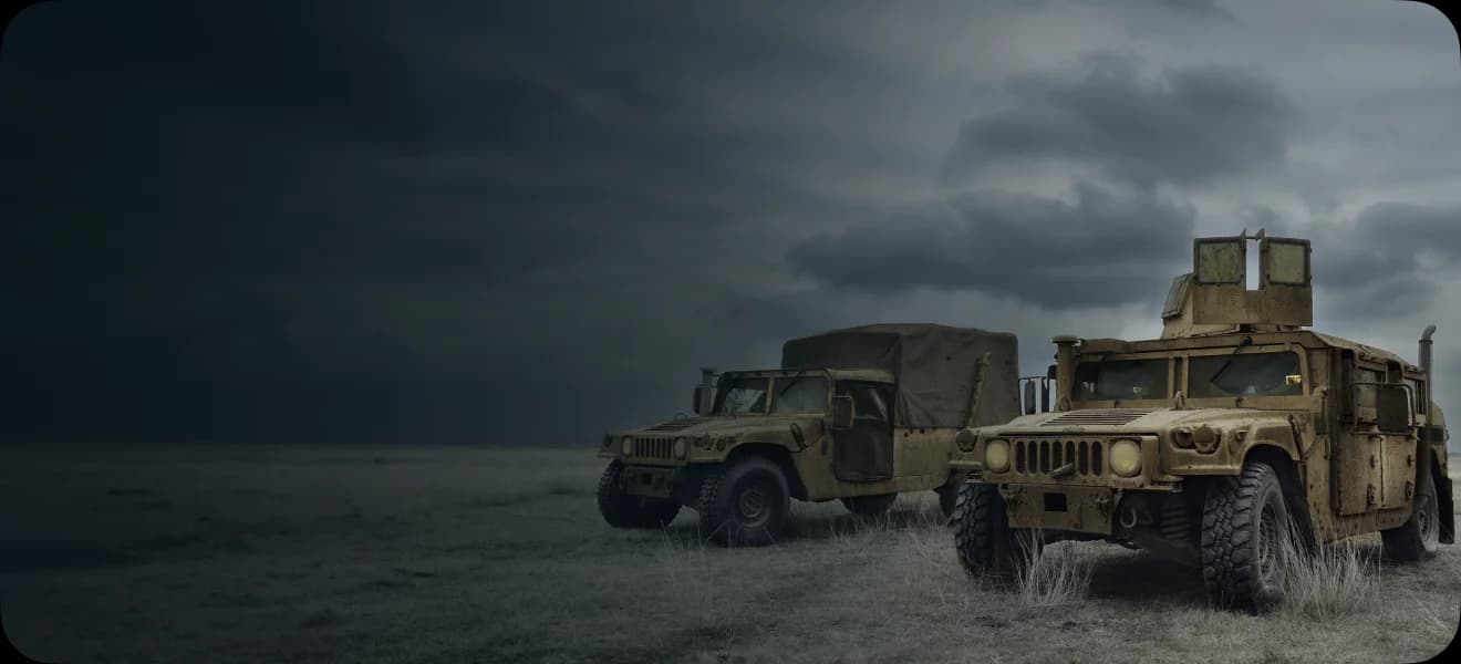 Two military vehicles parked