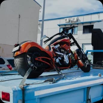 A Motorcycle strapped over a carrier