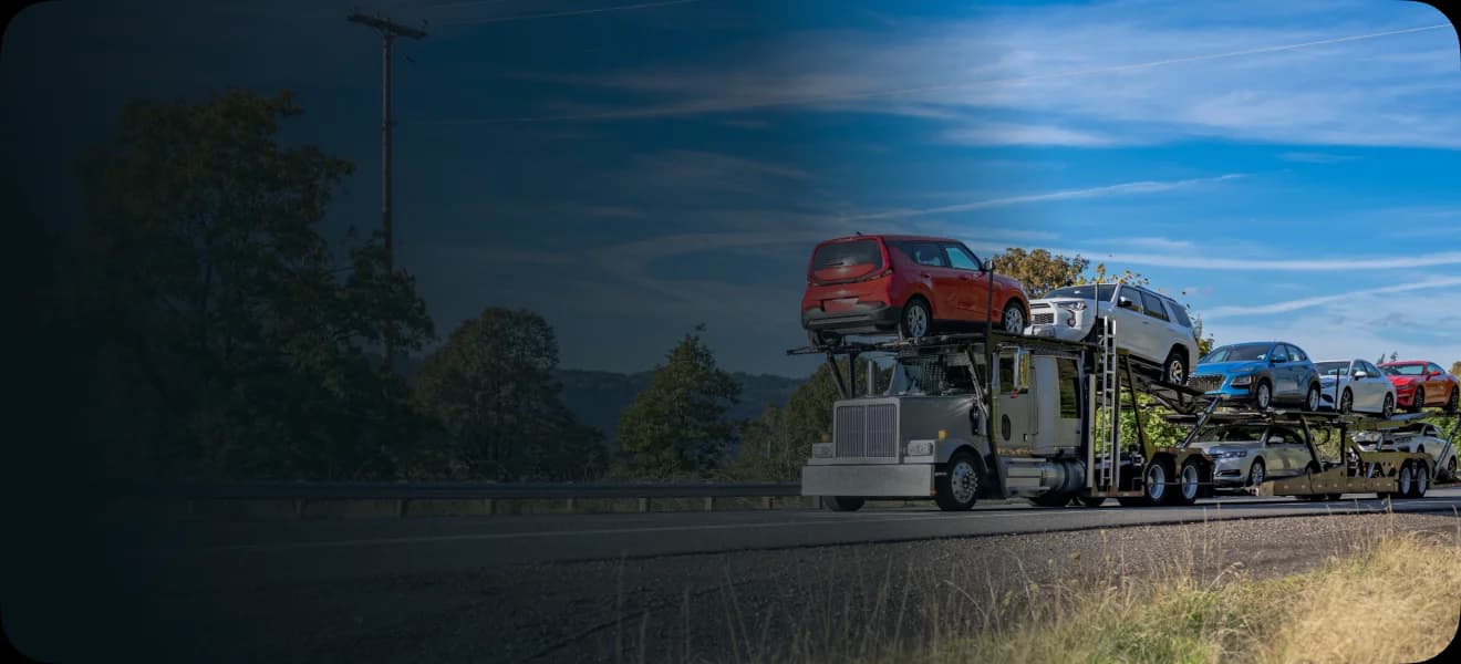 Cars shipped in a double-decker truck on road