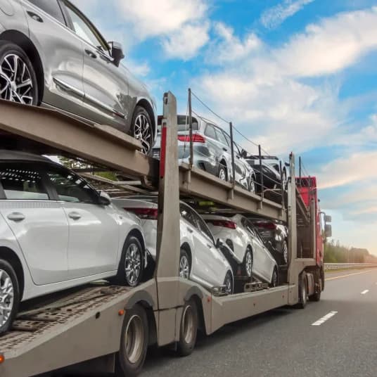 Cars being shipped in double storied truck