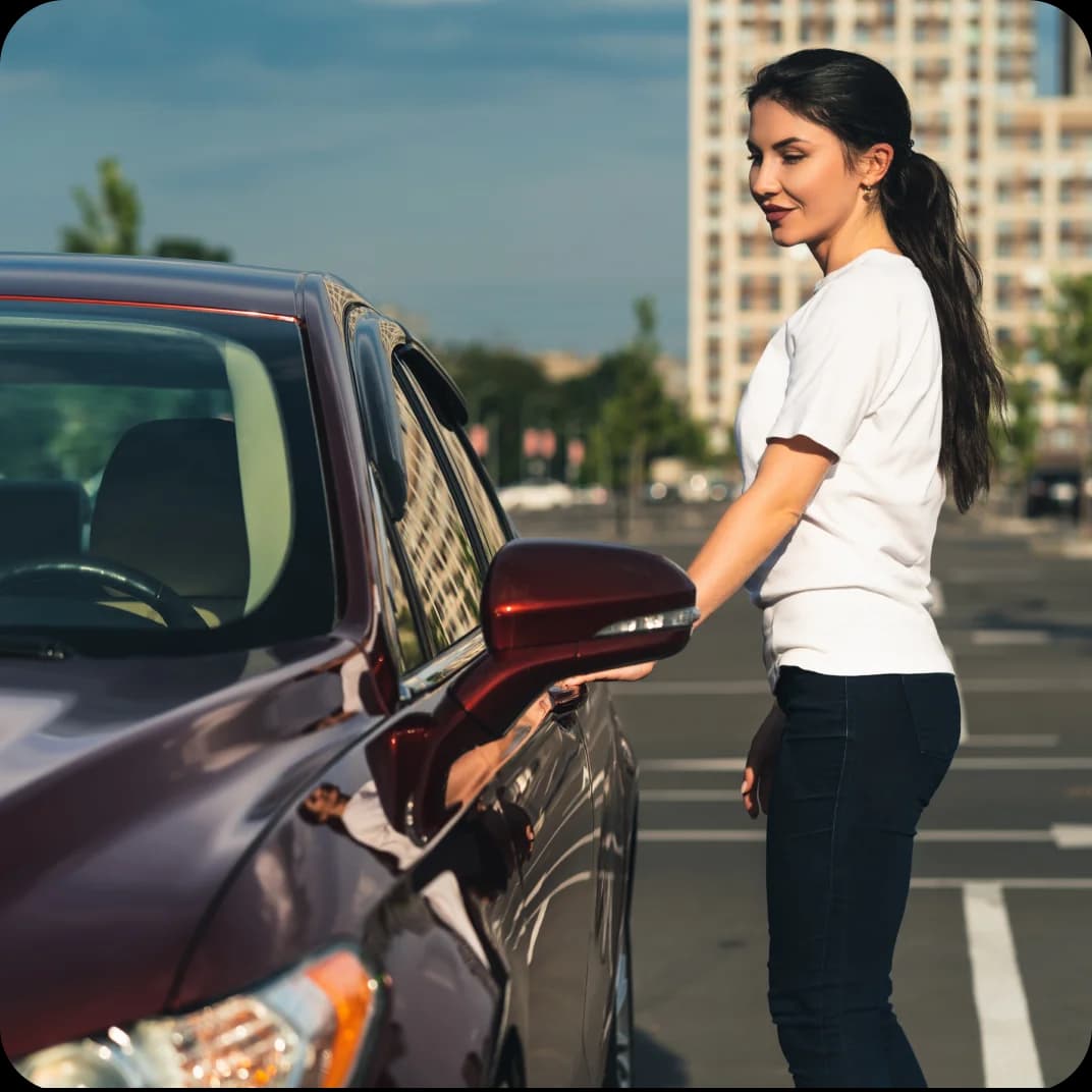 Woman getting into car