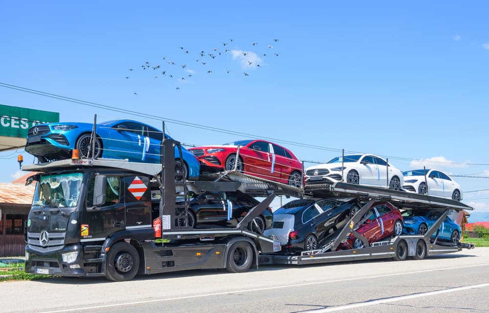Image related to blog title A car hauler loaded with vehicles highlights the state of the auto transport industry