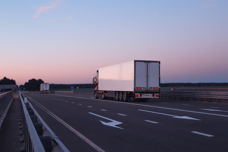 Image related to blog title Truck on highway at sunset managed by a carrier dispatcher ensuring timely and efficient freight delivery