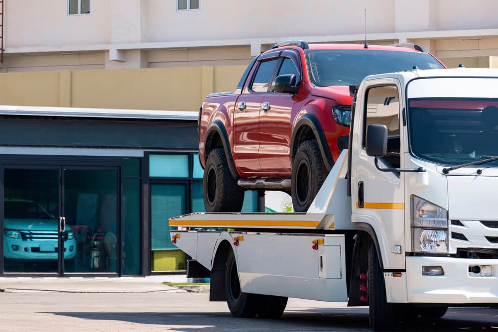 Image related to blog title Efficiently shipping a pickup truck with a flatbed tow truck ensures safe and hassle-free transport.